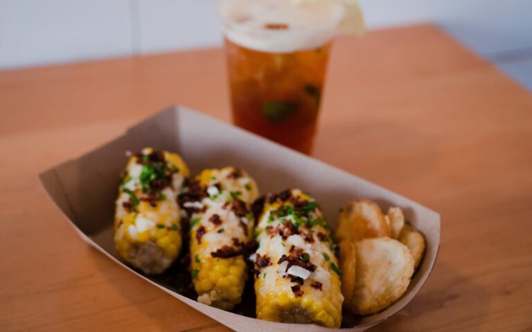 Buoy Shack's New England Street Corn is shown with Pineland Farms Cheddar Cheese, North County bacon, and maple mayo.